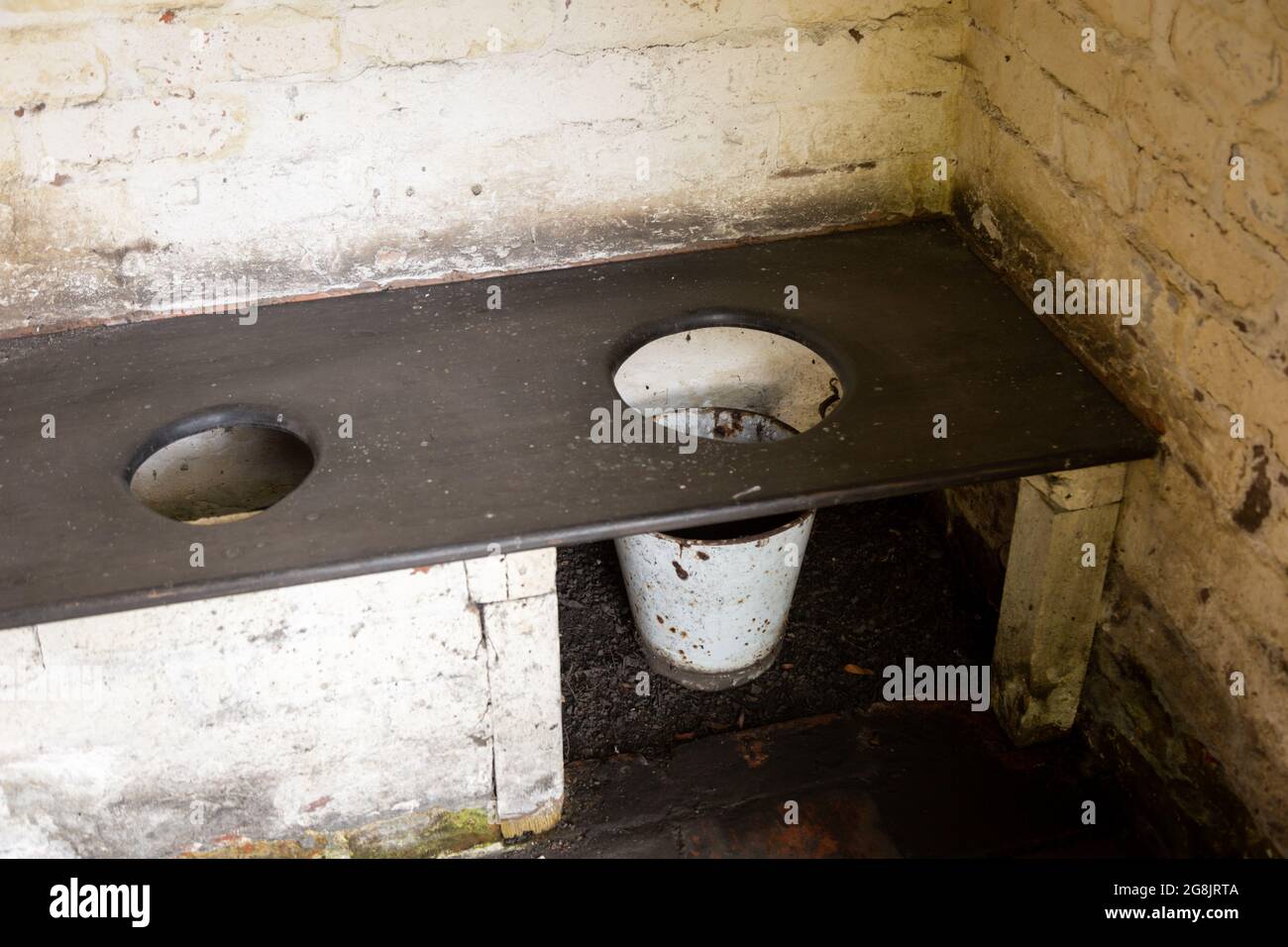 Old fashioned privy or toilet in an outside building, BCLM UK Stock Photo