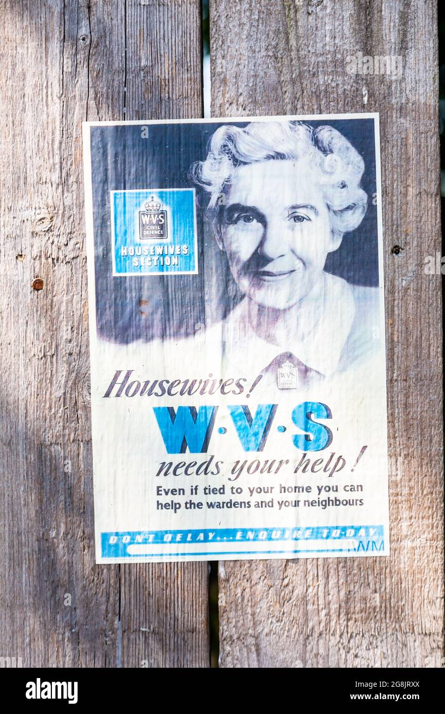 Old Womens Voluntary Service recruitment poster on a wooden fence Stock Photo