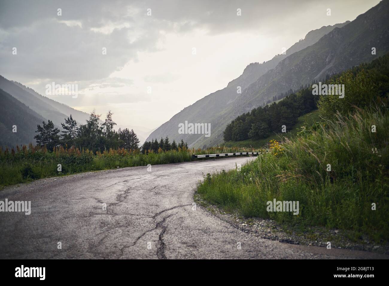 Asphalt road serpentine in the mountains in Kazakhstan. Famous mountain road to Big Almaty Lake. Stock Photo