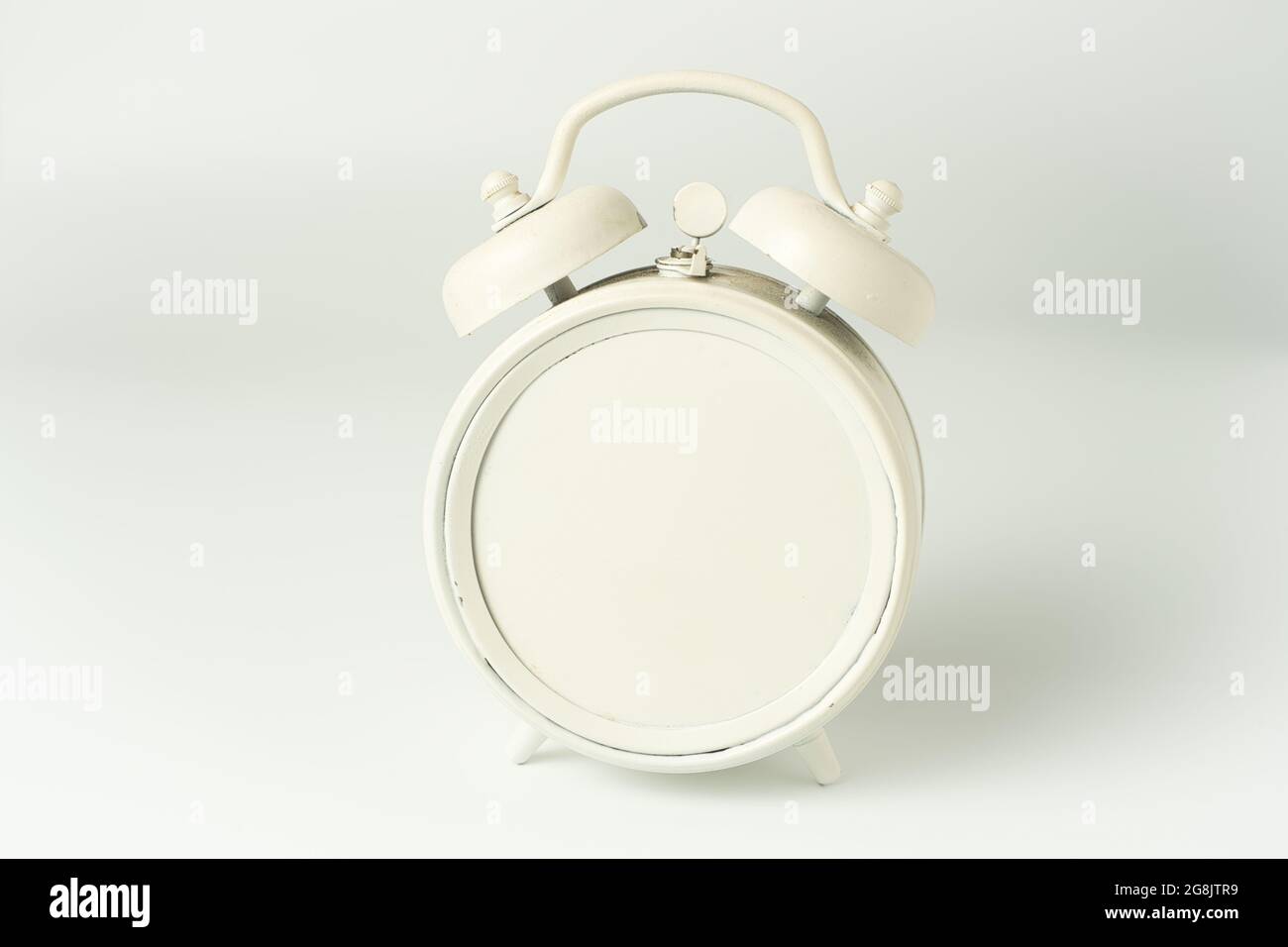 White alarm clock bell with blank plate on a white background Stock