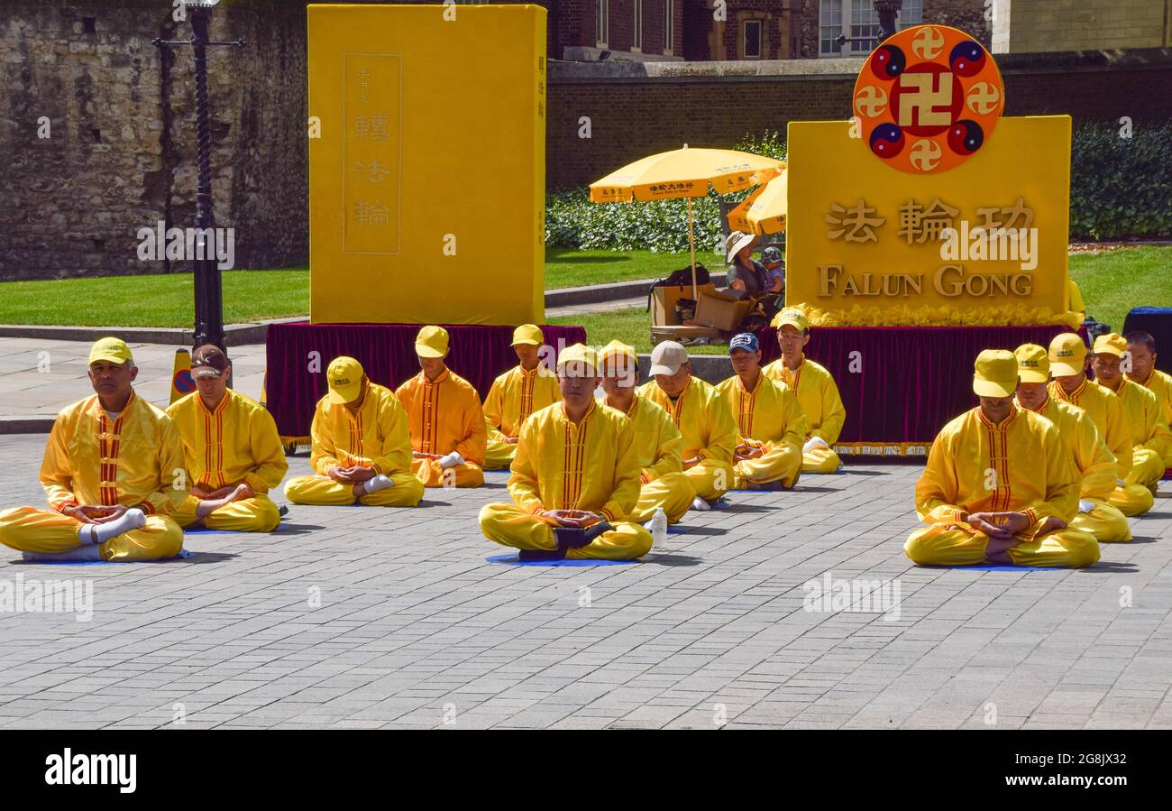 London, United Kingdom. 18th July 2021. Falun Gong practitioners and supporters gathered outside the Houses of Parliament to protest against the Chinese government's persecution, according to the protesters, of Falun Gong (also known as Falun Dafa) meditation practitioners, through abductions, imprisonment, torture, and organ harvesting. Stock Photo