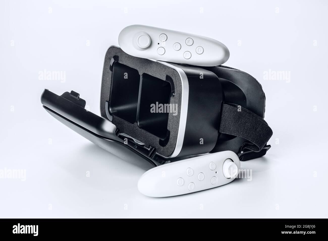 Virtual Reality glasses and game pad Isolated on white background. Stock Photo