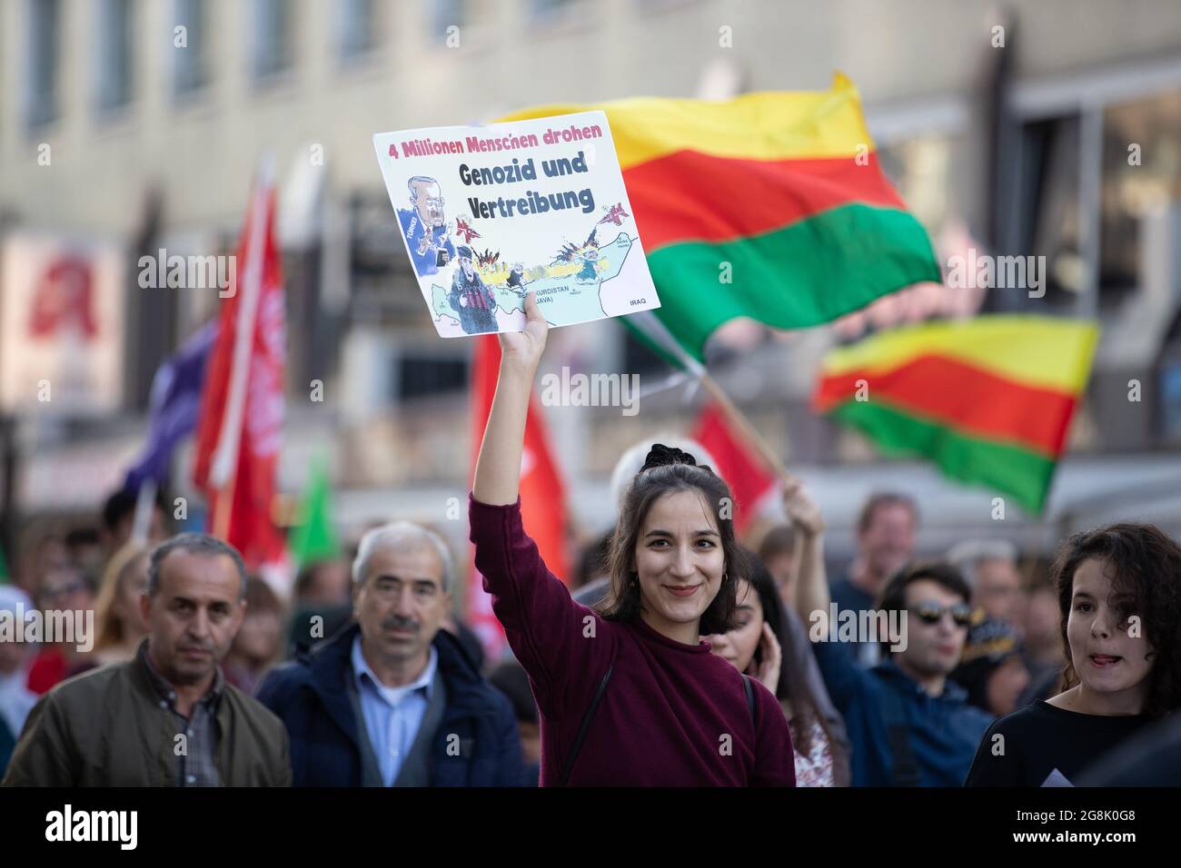 Munich, Germany. 26th Oct, 2019. Sign reading ' 4 Million people thretened of genocide and displacement '. On 26. October 2016 around 800 people joined a demonstration in solidarity of the Kurdish people in Syria, who are being attacked by the Turkish military. (Photo by Alexander Pohl/Sipa USA) Credit: Sipa USA/Alamy Live News Stock Photo