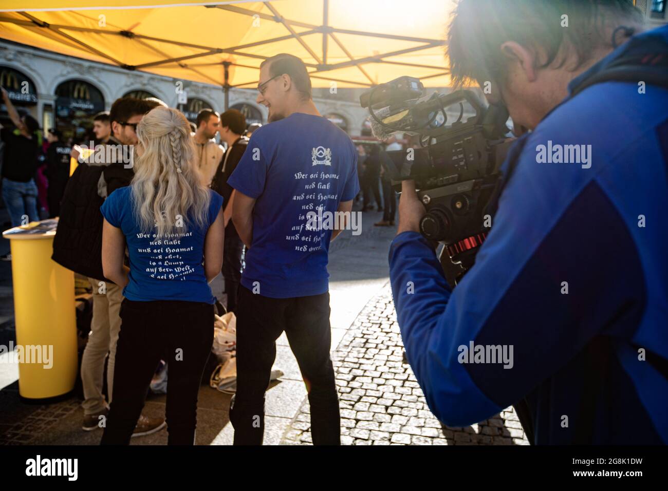 Munich, Germany. 26th Oct, 2019. RT/Ruptly cameraman films the T-Shirts of the extreme right activists. The extreme right Verfassungsschutz surveilled Identitaere Bewegung held a rally on 26. October 2016 in Munich. (Photo by Alexander Pohl/Sipa USA) Credit: Sipa USA/Alamy Live News Stock Photo
