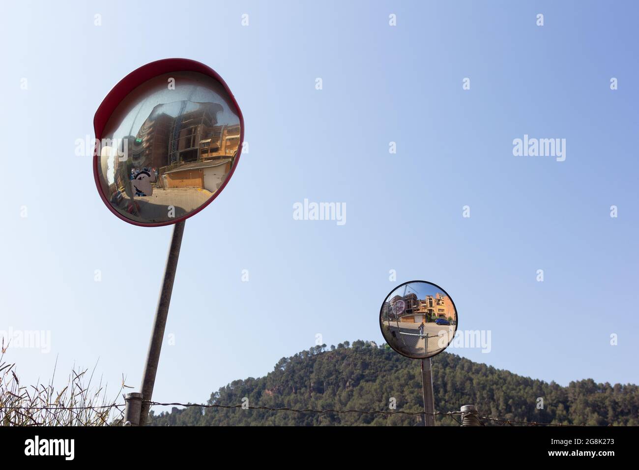 Wide-angle mirrors so drivers can see oncoming vehicles and avoid ...