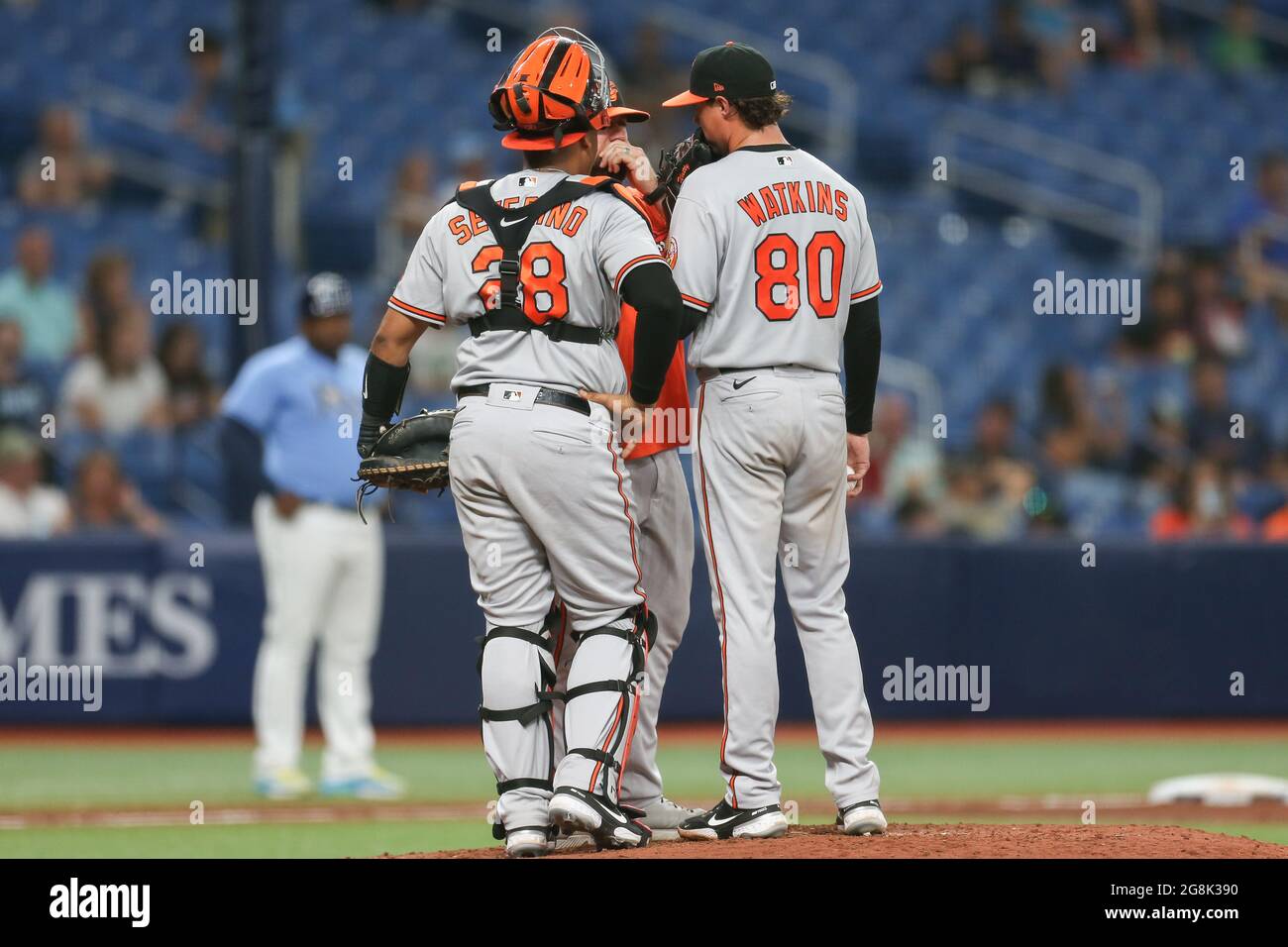 St. Petersburg, FL. USA;  Baltimore Orioles manager Brandon Hyde makes a visit to the mound and talks to starting pitcher Spenser Watkins (80) with  c Stock Photo
