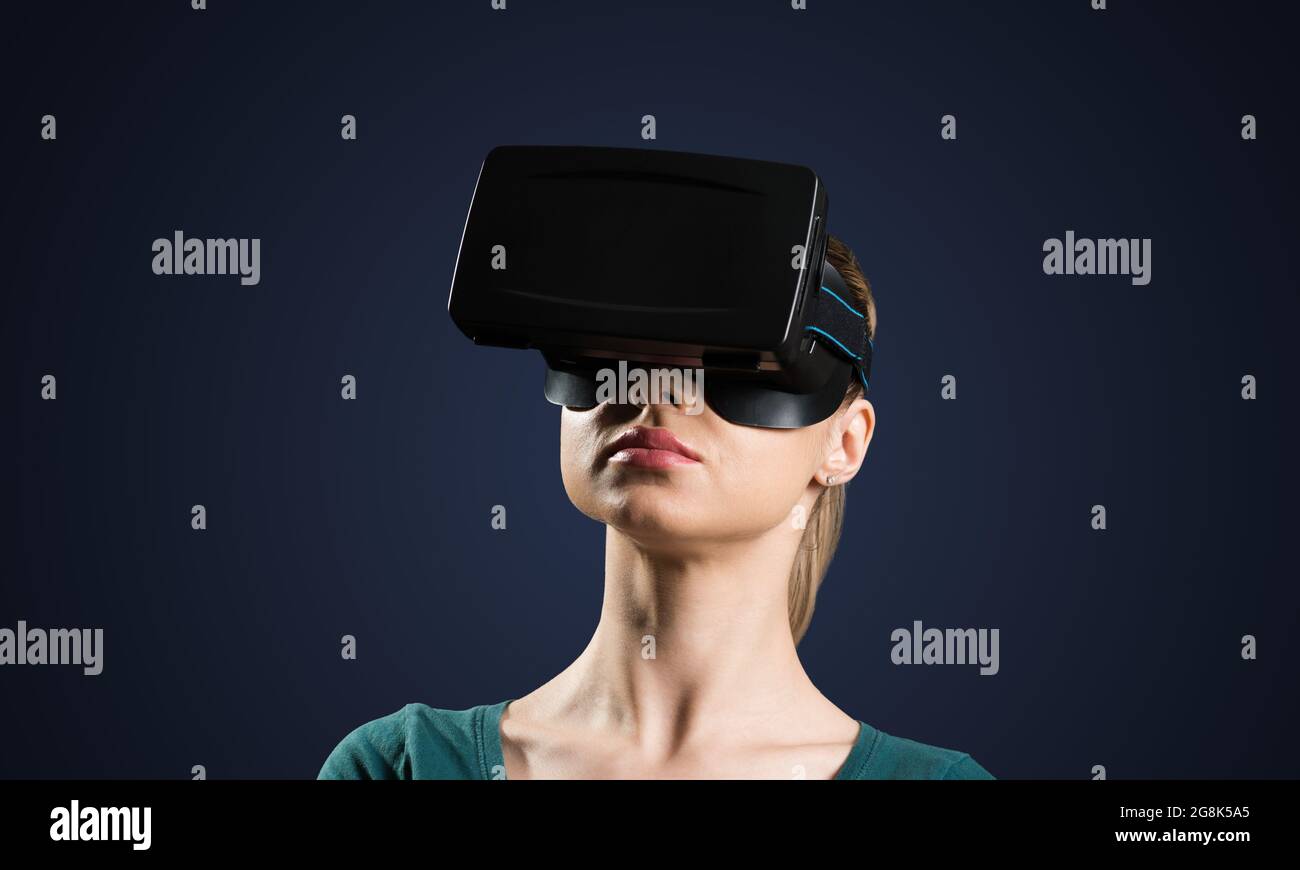 Young woman in VR glasses Stock Photo