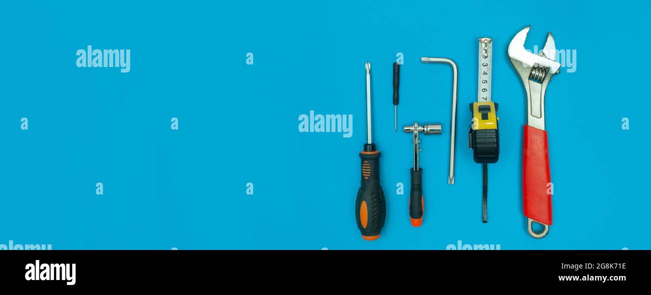 Tools Background Blue tools on isolated blue background panorama Stock Photo - Alamy