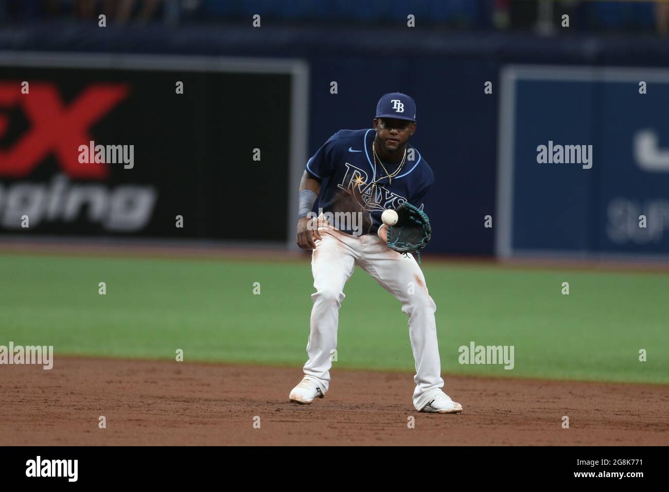 St. Petersburg, FL. USA; Tampa Bay Rays second baseman Vidal Brujan (7)  fields a ball at second and throws to first base during a major league  baseba Stock Photo - Alamy