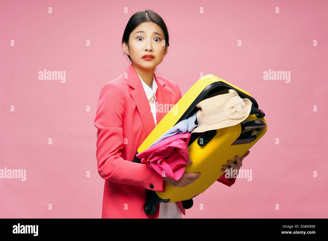 woman with suitcase clothes luggage passenger travel Stock Photo Alamy