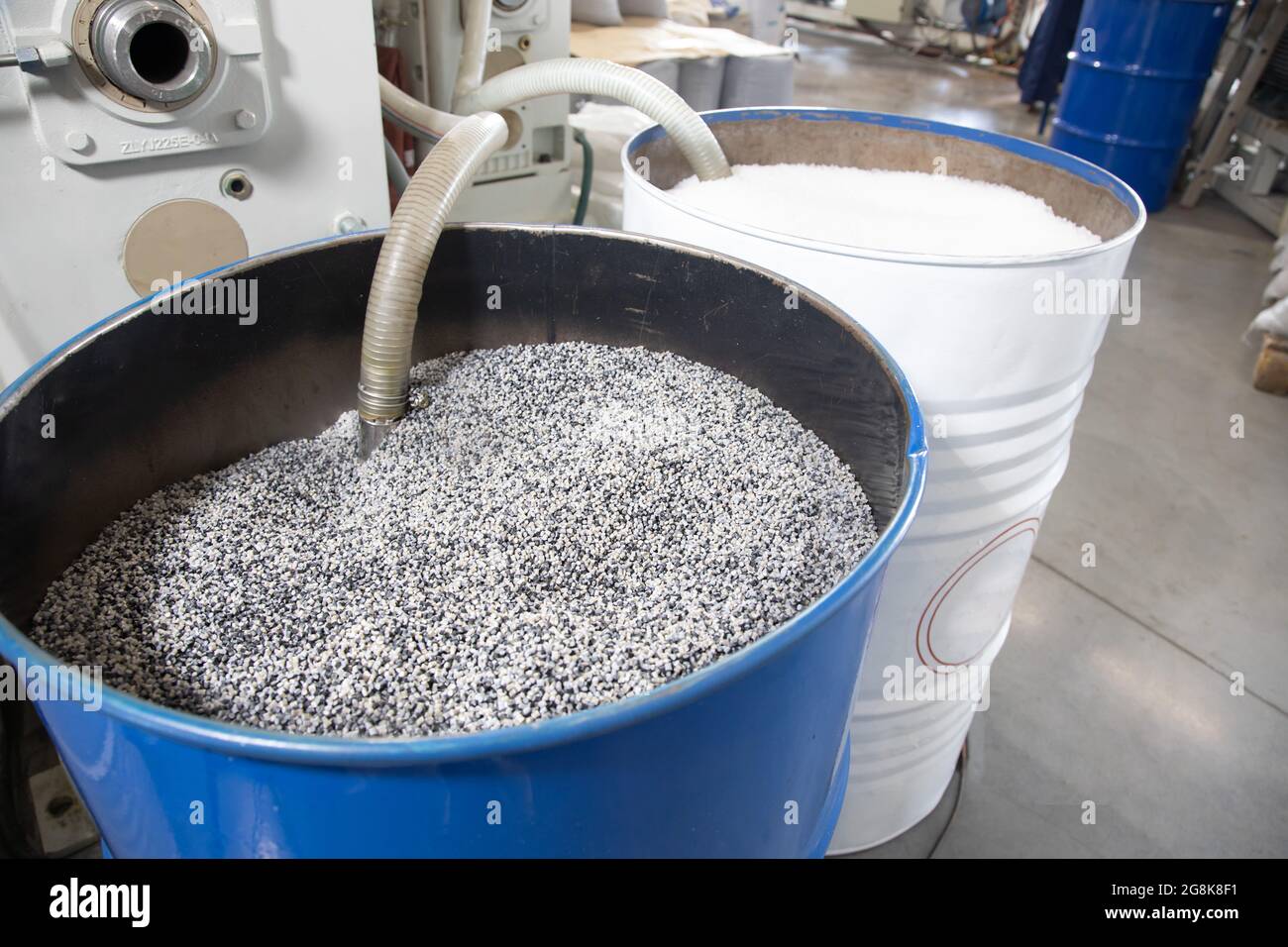 Open barrel full grain malt. White polypropylene bag. PP Stock Photo