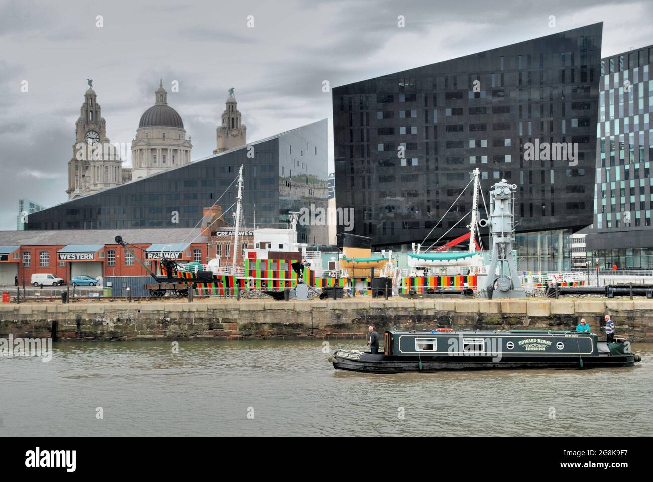 Liverpool Canning Dock waterfront with offices, The Three Graces and Liver Buildings in the background Stock Photo