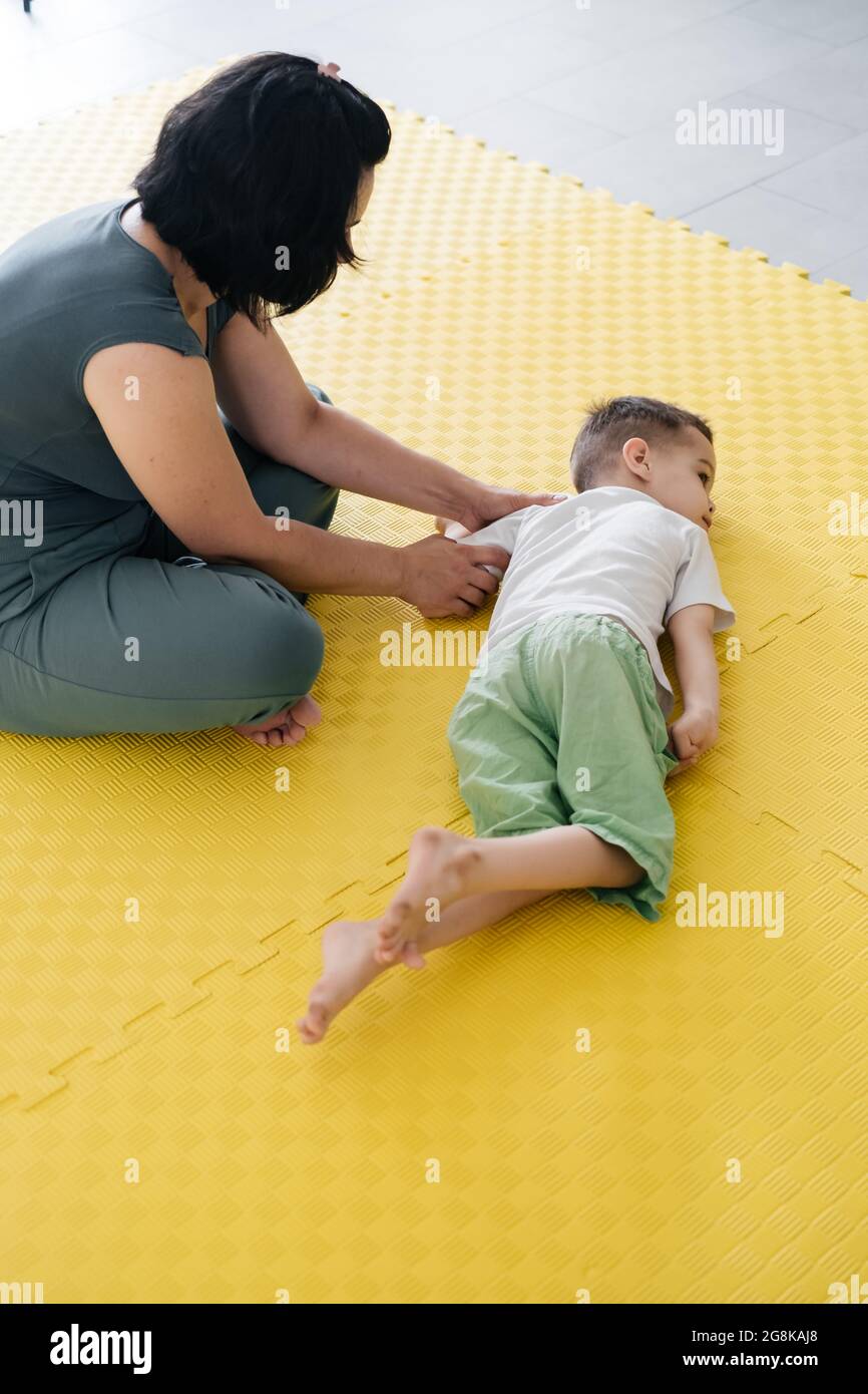 Rehabilitation of child with cerebral palsy in special center. Mother