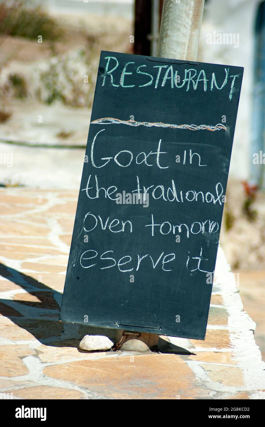 Anafi island Greece Taverna menu on a blackboard Simple, authentic nutritious local food available for lunch Vertical shot with blurred background for Stock Photo