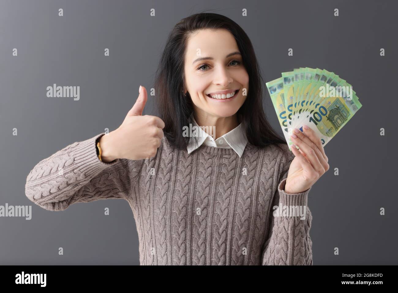 Woman smiling thumbs up gesture hi-res stock photography and images - Alamy