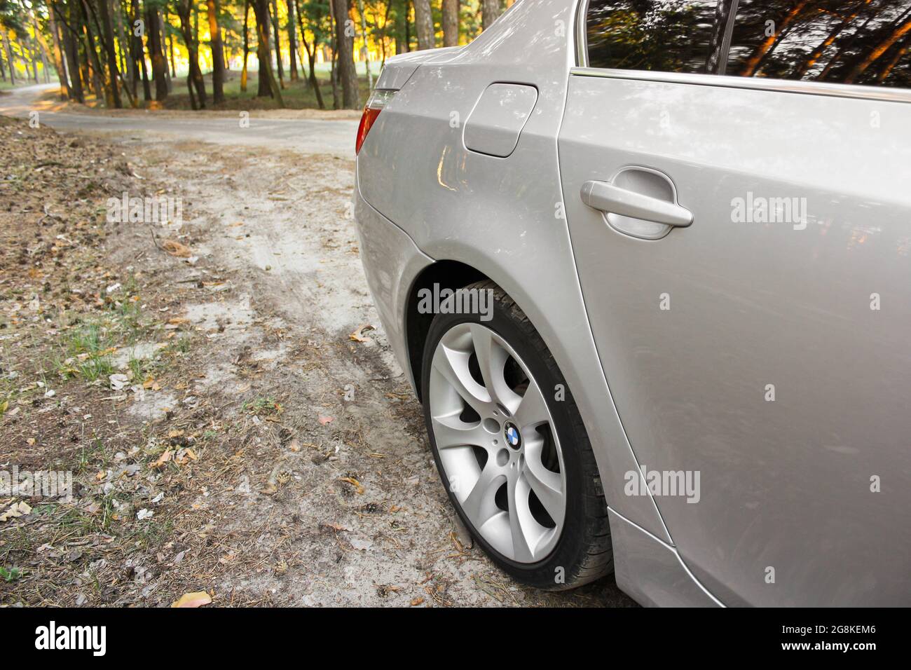 Chernihiv, Ukraine - July 6, 2018: BMW E60 on the forest road Stock Photo