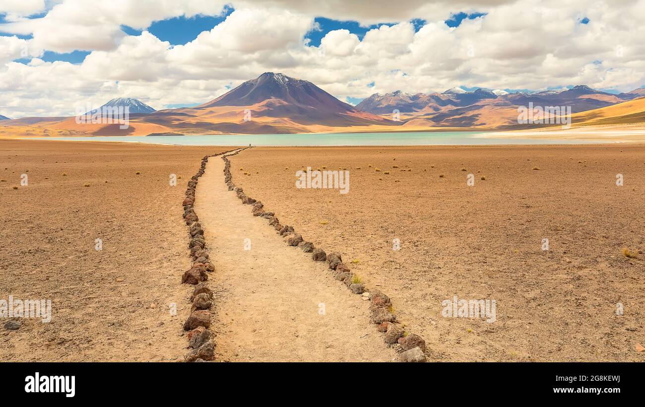 A tourist path and volcano in the Atacama desert near lake Miscanti in Chile, South America Stock Photo