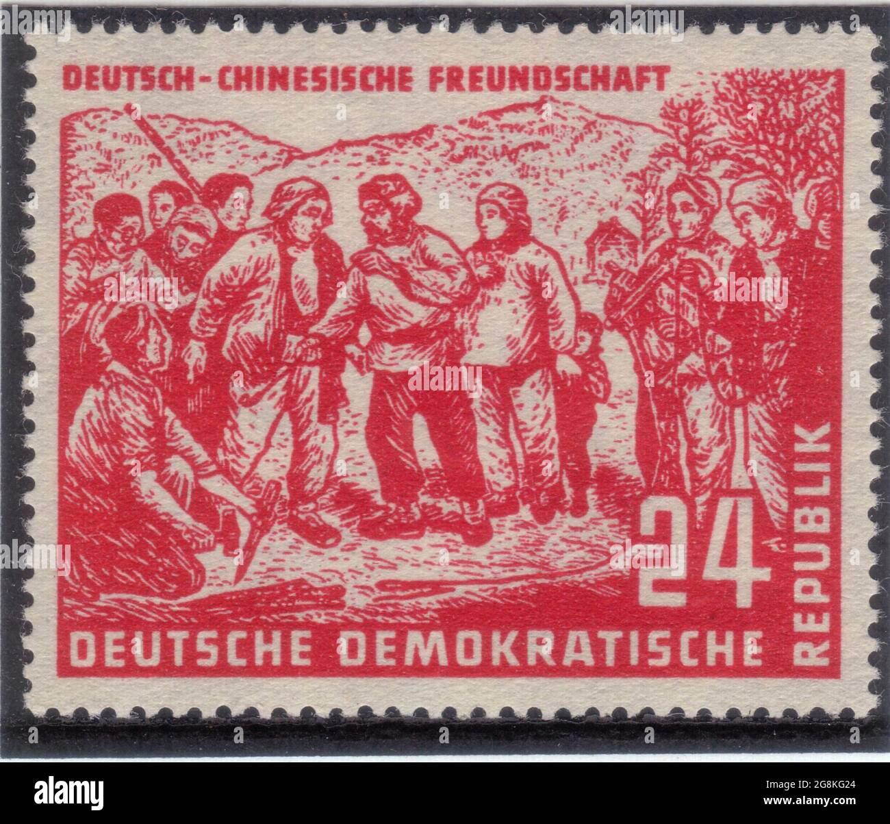 DDR [Deutsche Demokratische Republik (German Democratic Republic), official name of the former East Germany] depicting the German-Chinese Friendship 24pf Red issued July 10 1951 Stock Photo