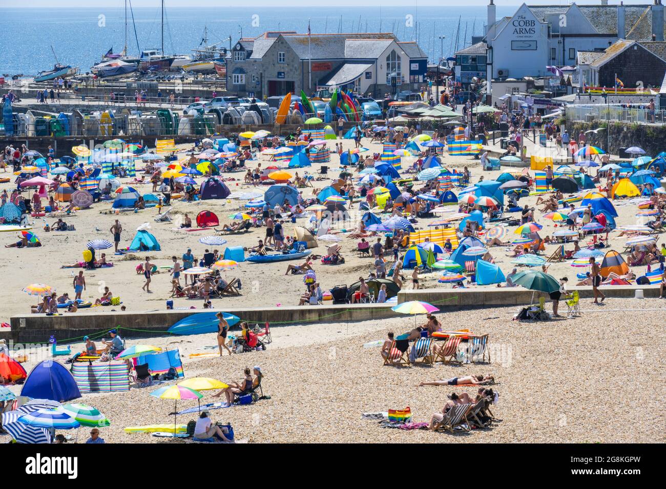 Lyme Regis, Dorset, UK. 21st July, 2021. UK Weather Crowds of