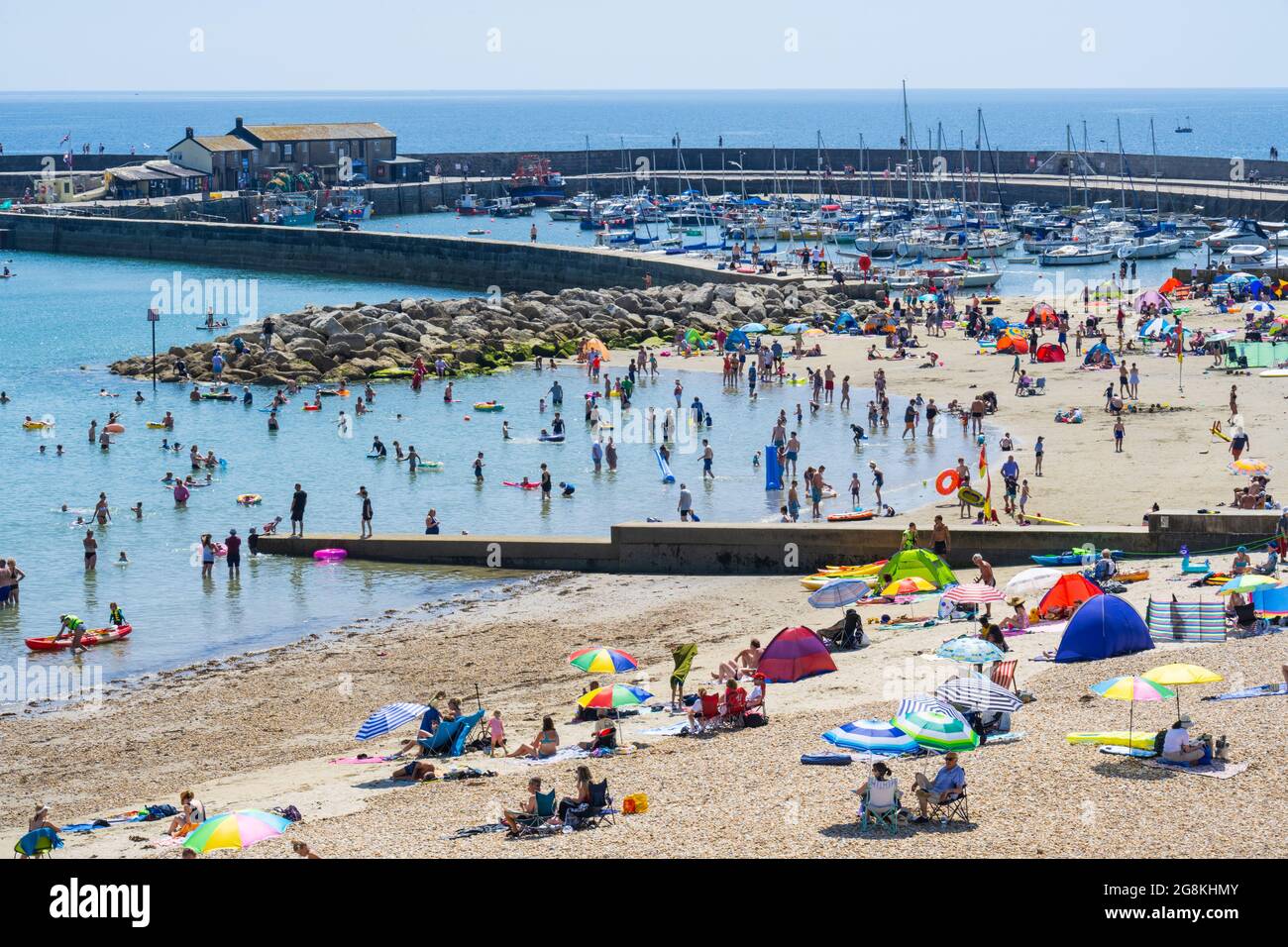 Lyme Regis, Dorset, UK. 21st July, 2021. UK Weather Crowds of