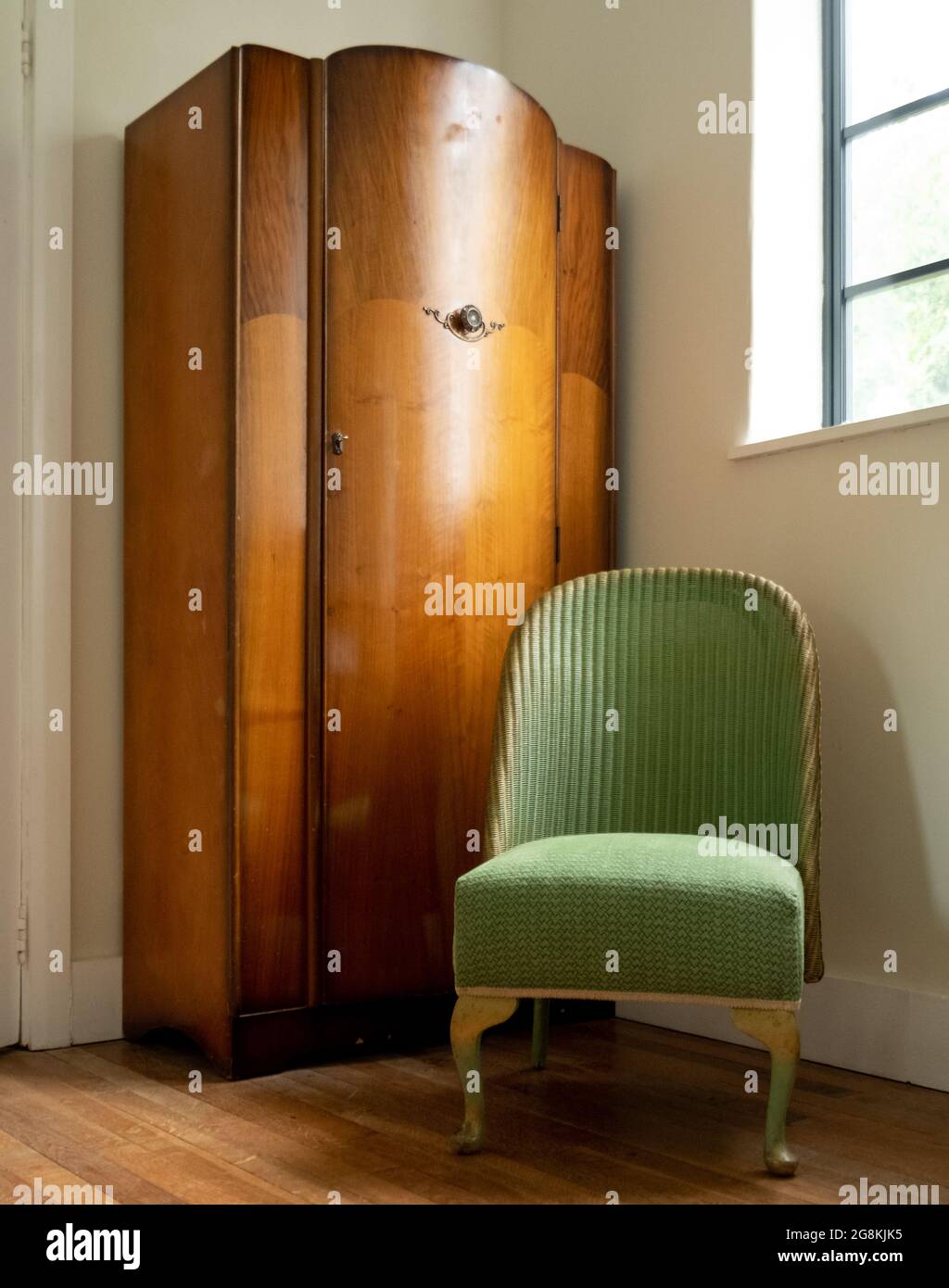 Original vintage green Lloyd Loom wicker rattan chair Stock Photo Alamy