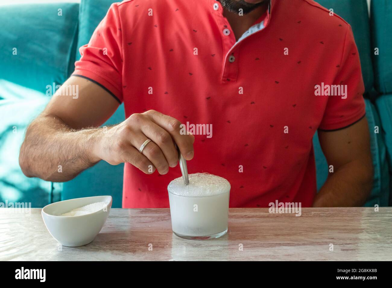 Caucasian man with stomach ache preparing fruit salt Stock Photo Alamy