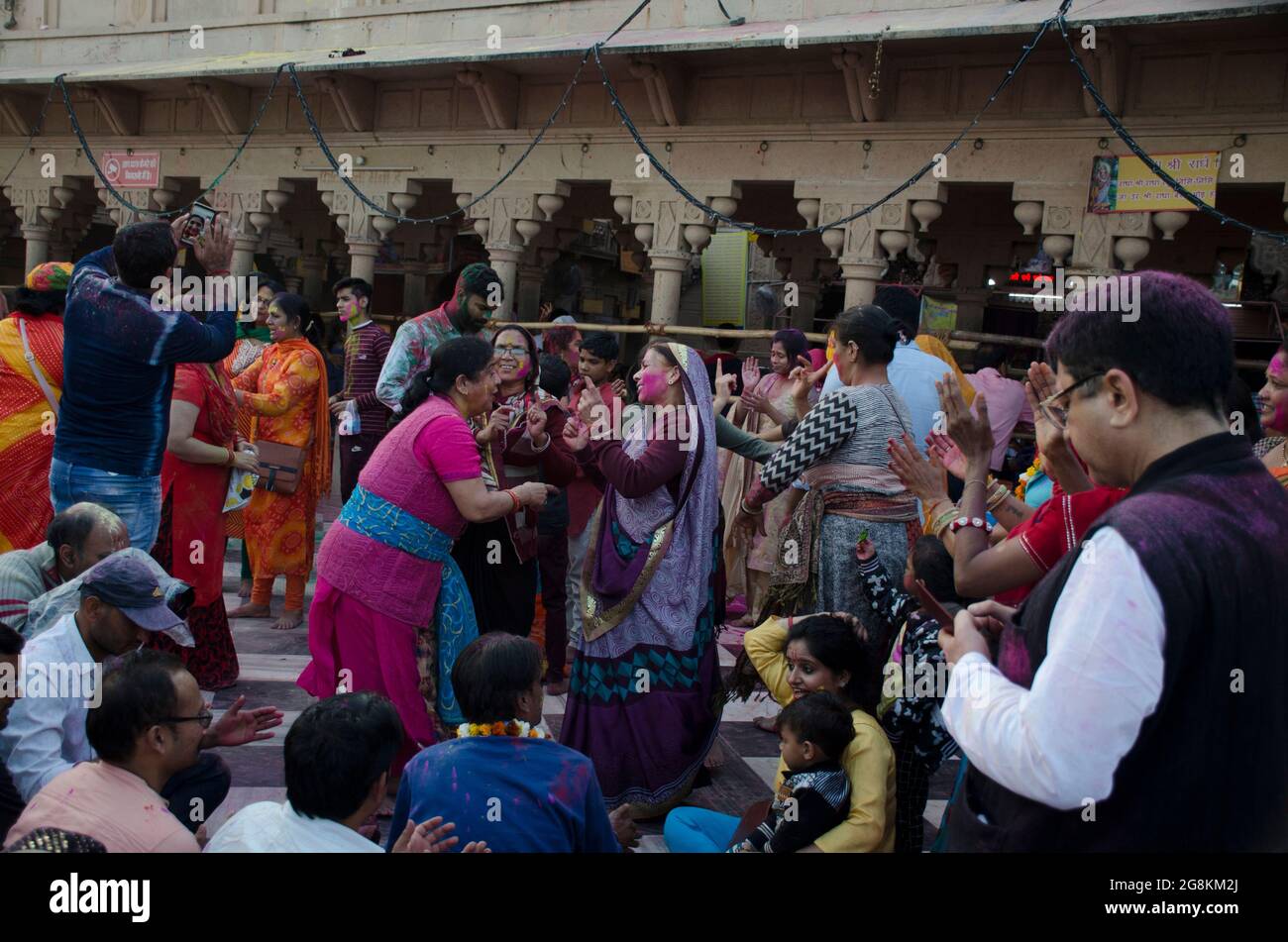 Devotees of a group of family is dancing to celebrate the the Holi festival in India. Stock Photo