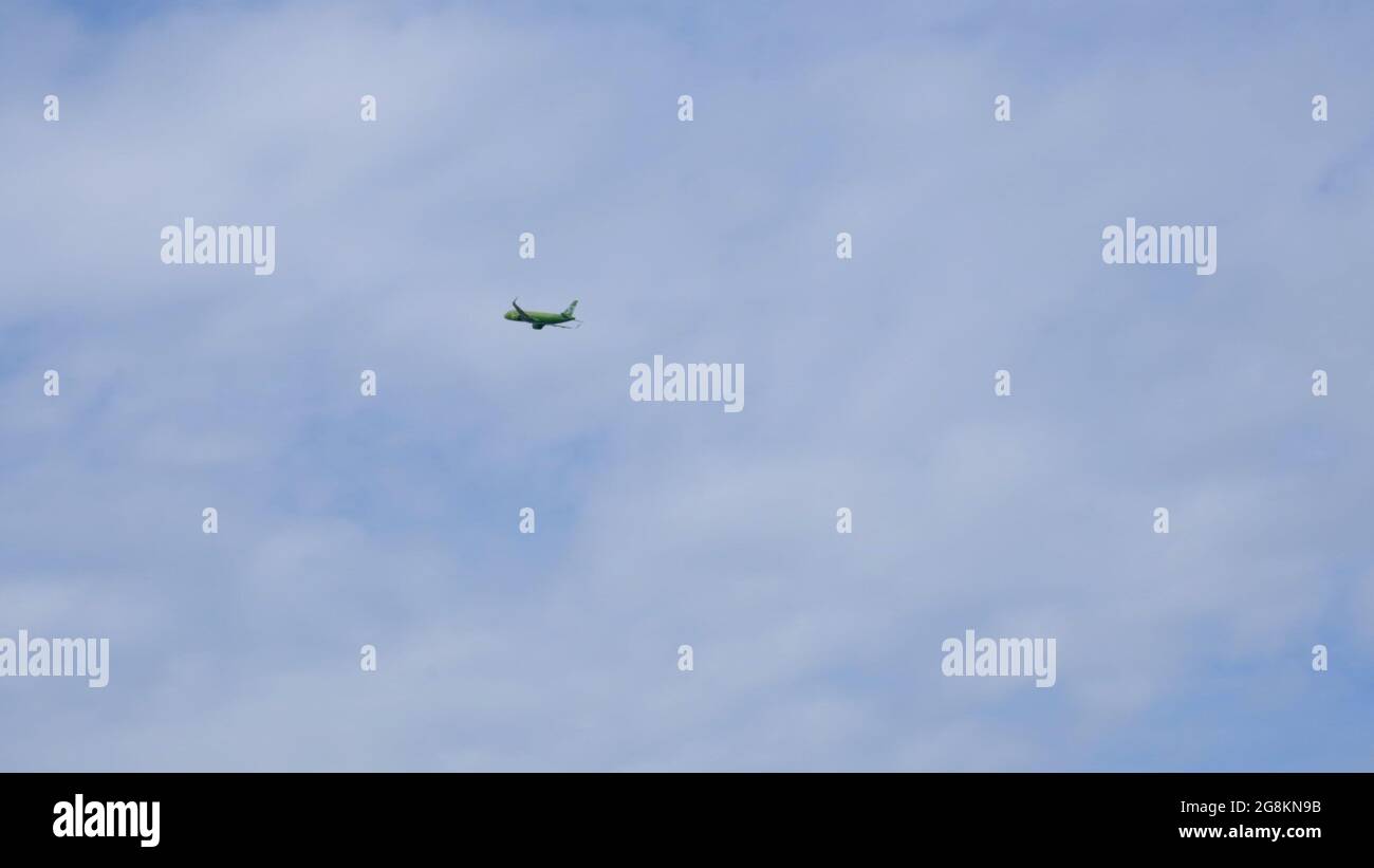 Silhouette Modern large plane flies in the sky. Beautiful blue sky and ...