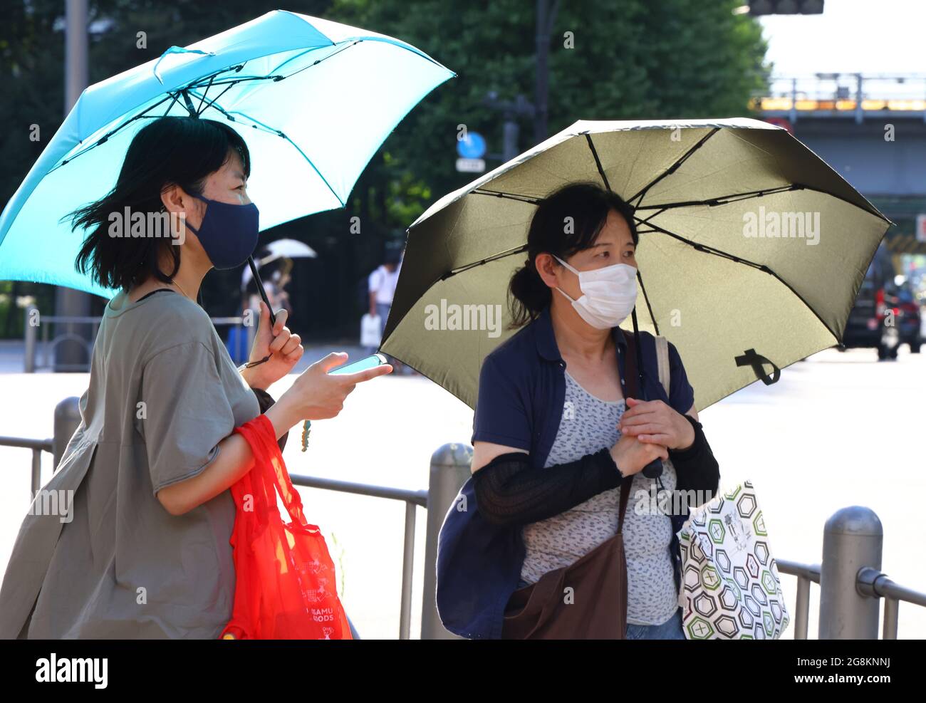 Tokyo Japan July 21 21 Women Carry Umbrellas In The City S Centre Tokyo Was To Host The Summer Olympic Games On July 24 August 9 The Games Were Postponed For Tokyo Japan July 21 21 Women Carry Umbrellas In The City S Centre Tokyo Was To Host The Summer Olympic Games On July 24 August 9 The Games Were Postponed For