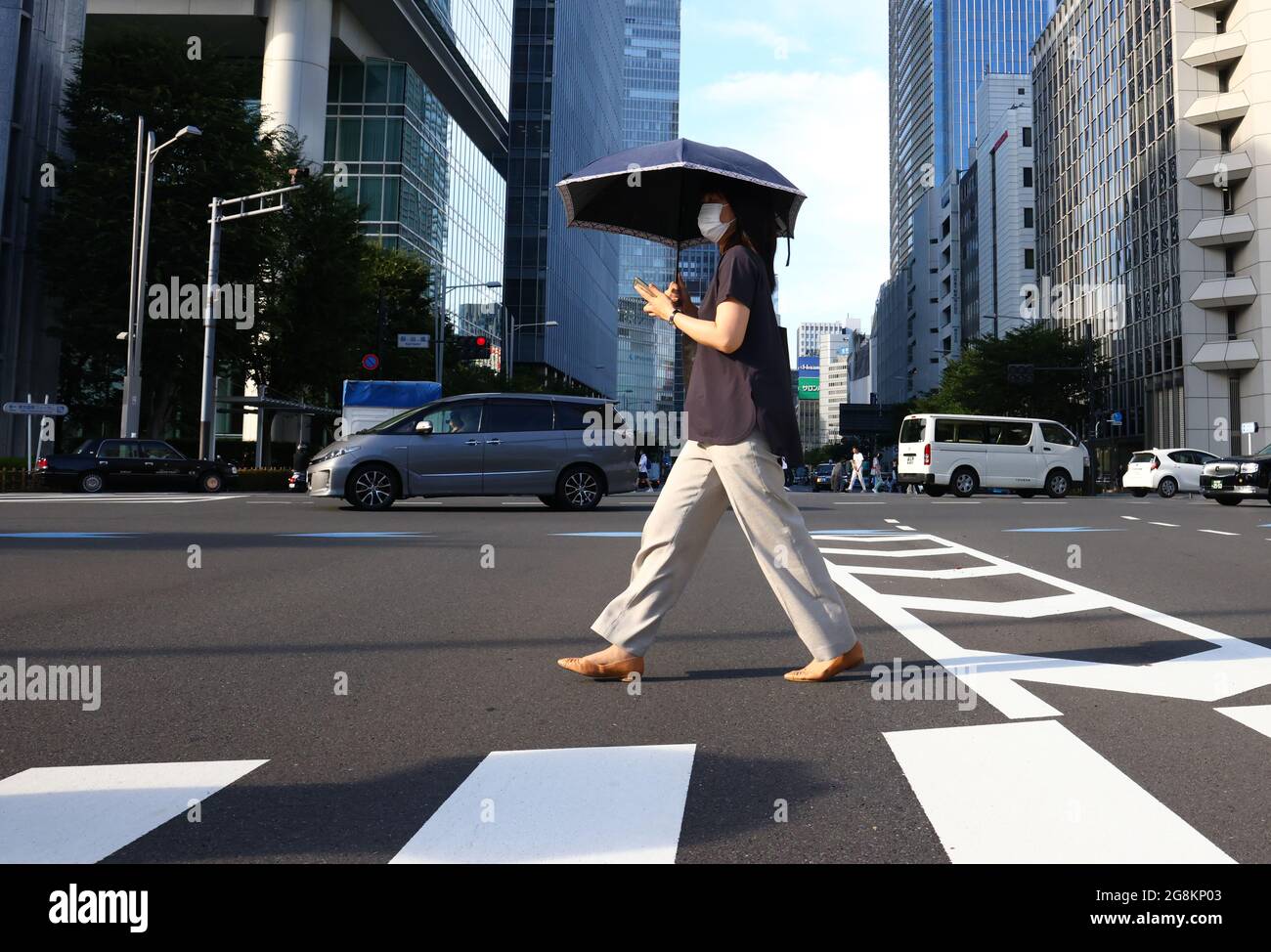Tokyo Japan July 21 21 A Woman Crosses A Street In The City S Centre Tokyo Was To Host The Summer Olympic Games On July 24 August 9 The Games Were Tokyo Japan July 21 21 A Woman Crosses A Street In The City S Centre Tokyo Was To Host The Summer Olympic Games On July 24 August 9 The Games Were