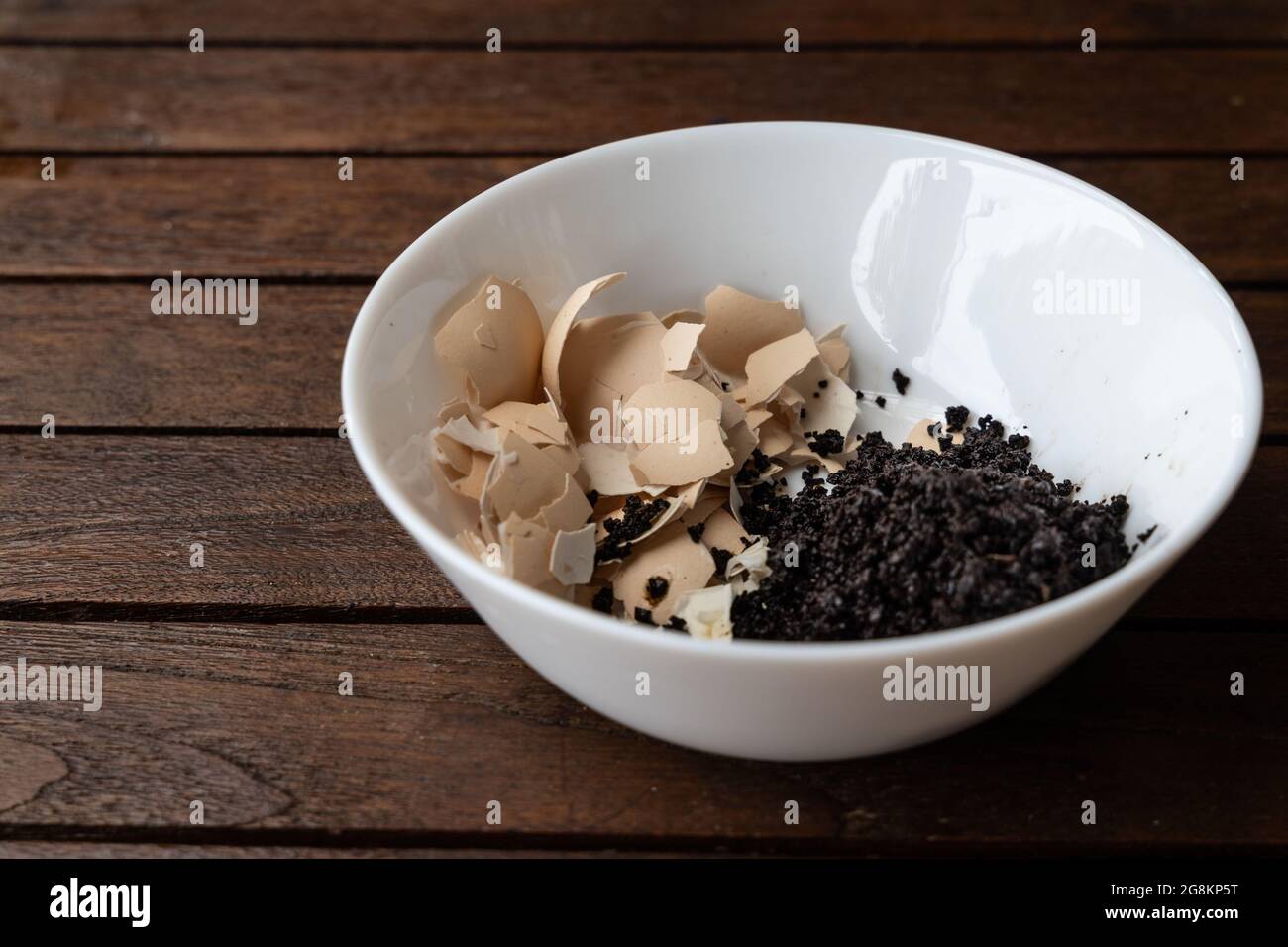 Crushed egg shell and spent coffee grounds in bowl. Natural organic