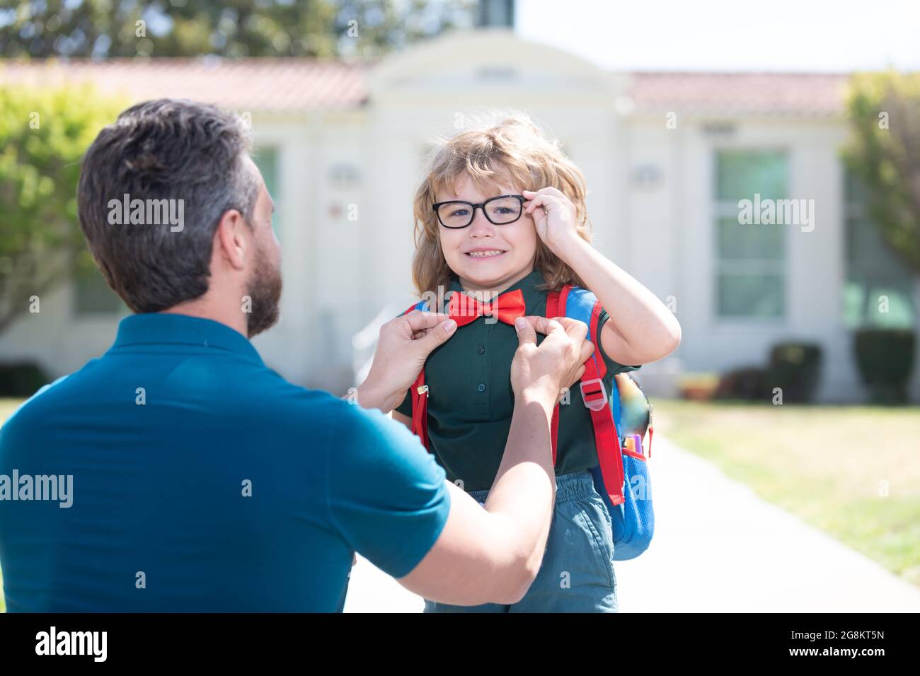 first day at school. father and son come back from school. happy family value Stock Photo