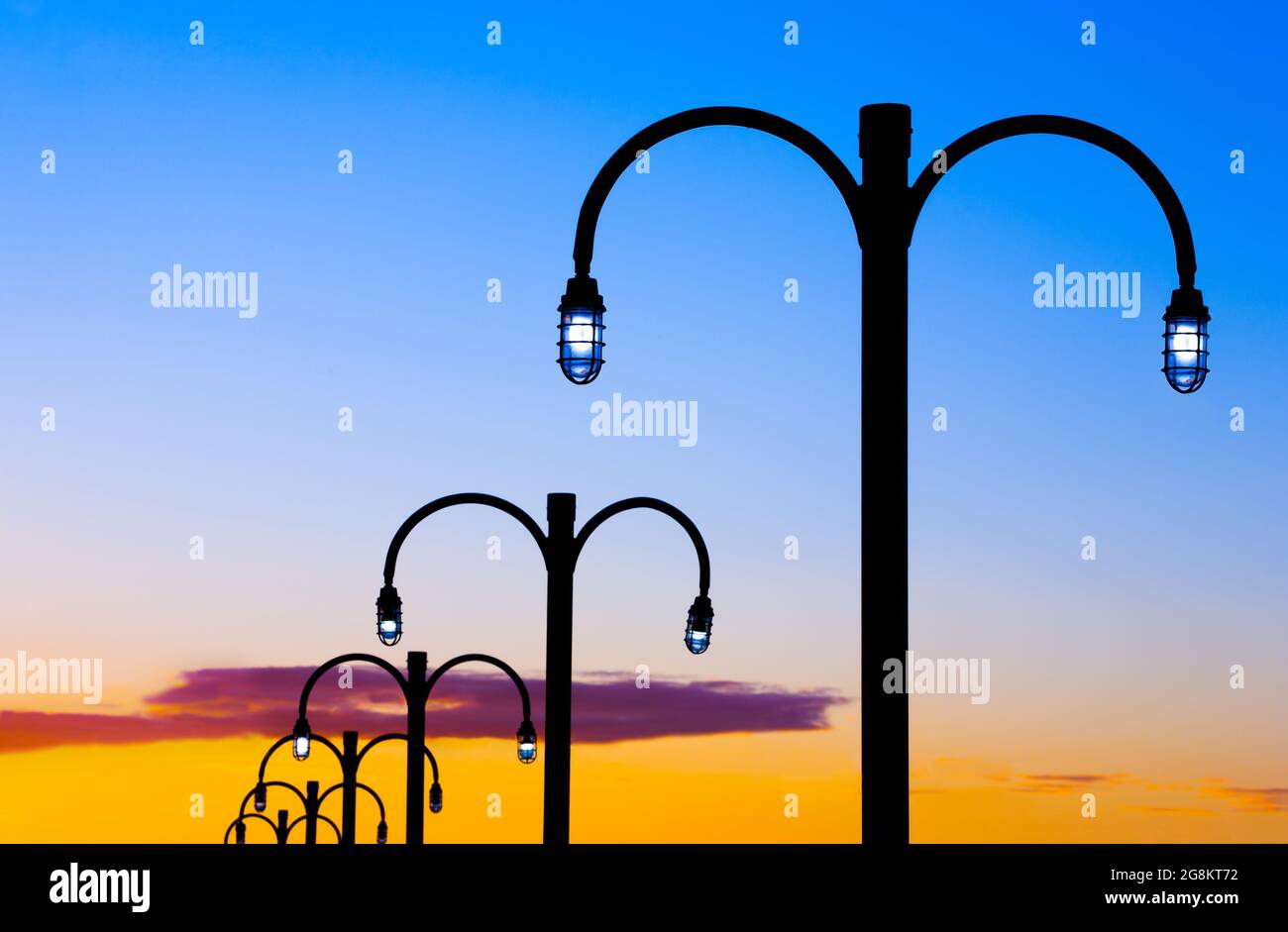 Ornate street lamps during twilight. Stock Photo