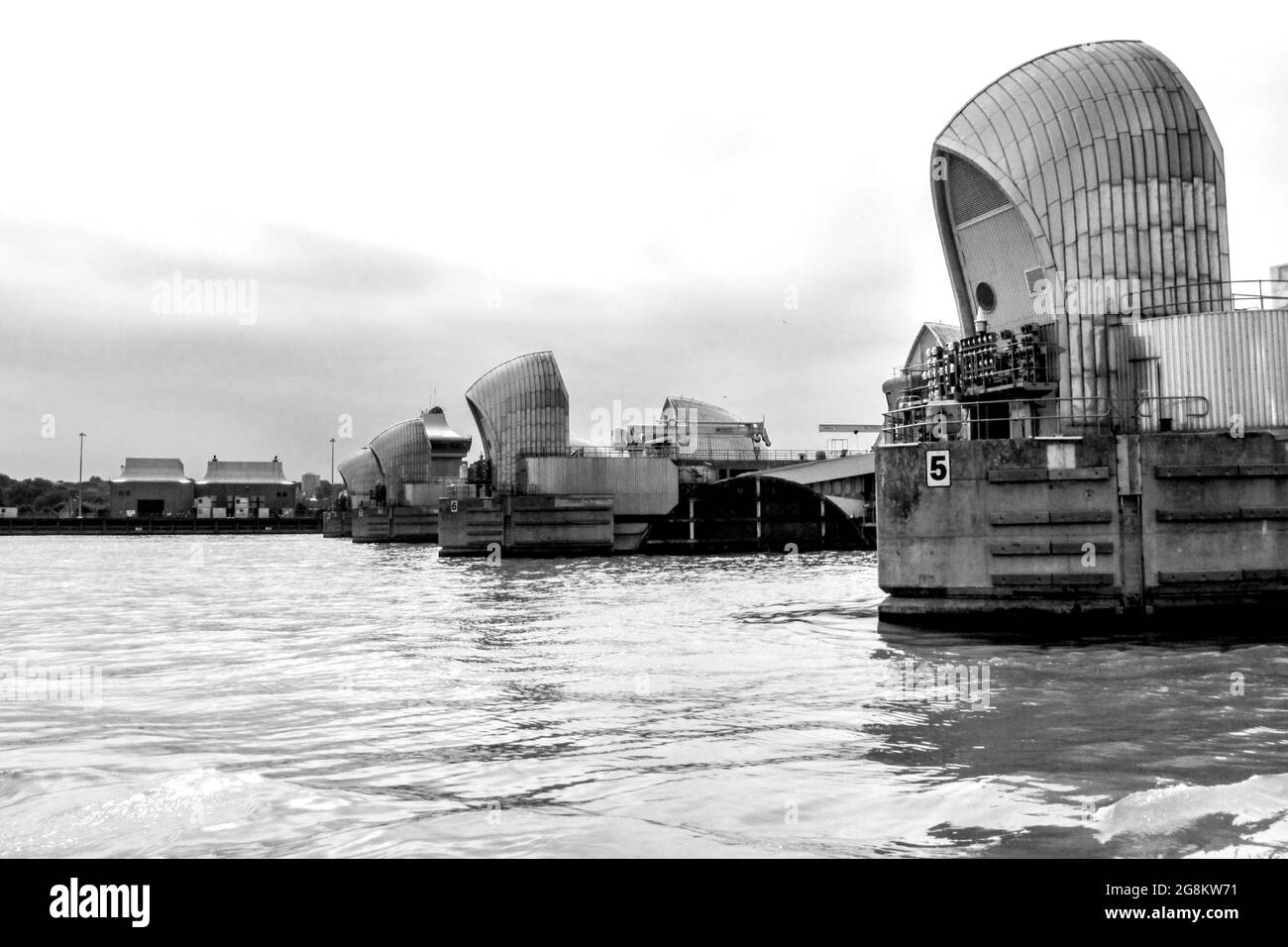 Looking along the line of the Steel-clad shells of the gates of the Thames barrier in the Thames estuary Stock Photo