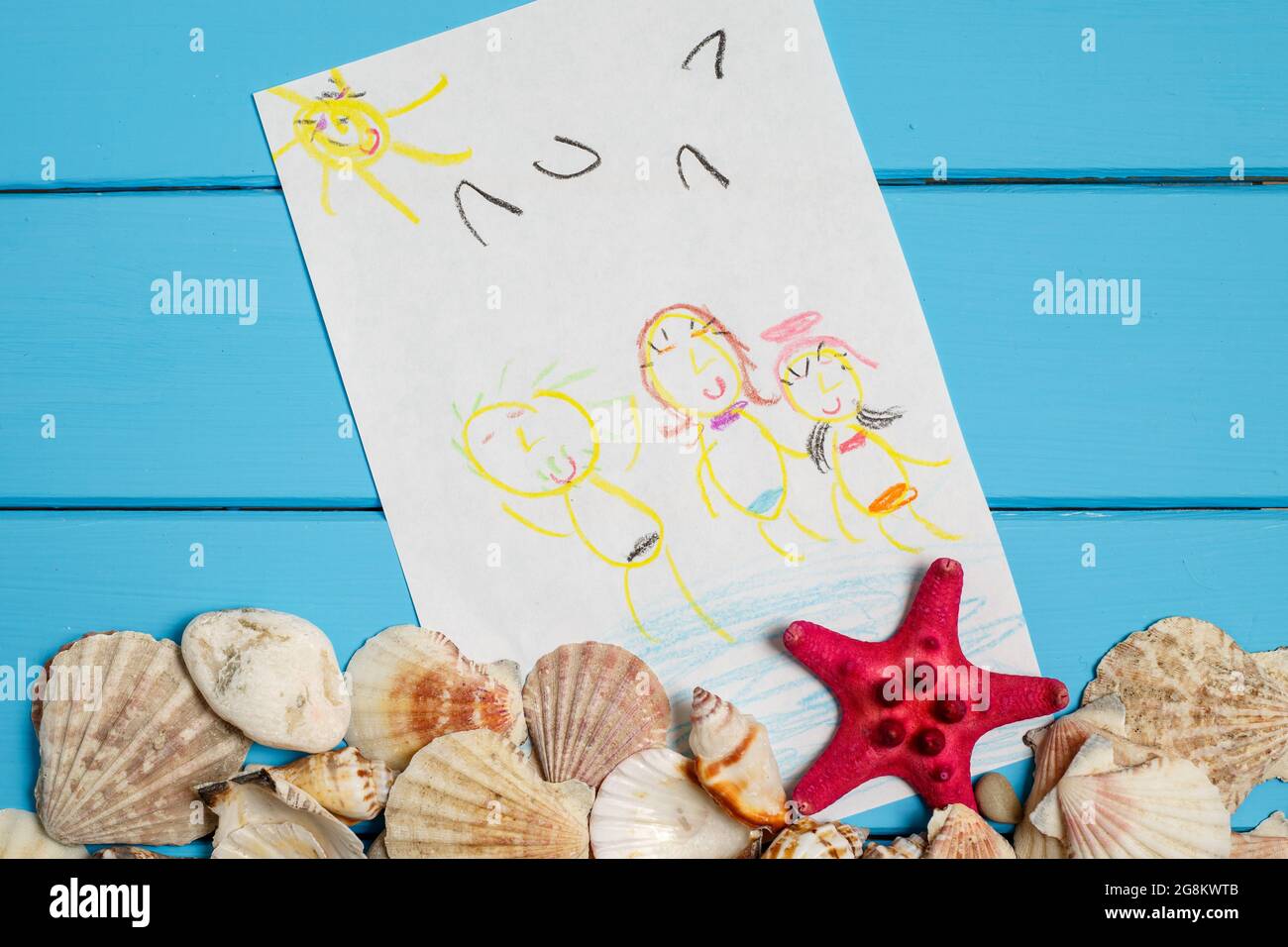 Summer background with the seashells and children's drawing Stock Photo