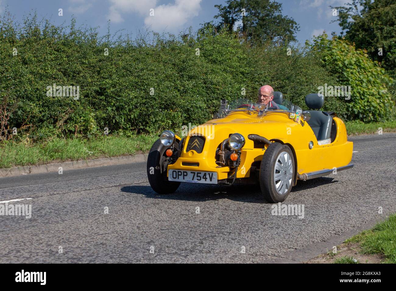 1980 80s yellow Citroen LOMAX  602cc two seater cabriolet en-route to Capesthorne Hall classic July car show, Cheshire, UK Stock Photo