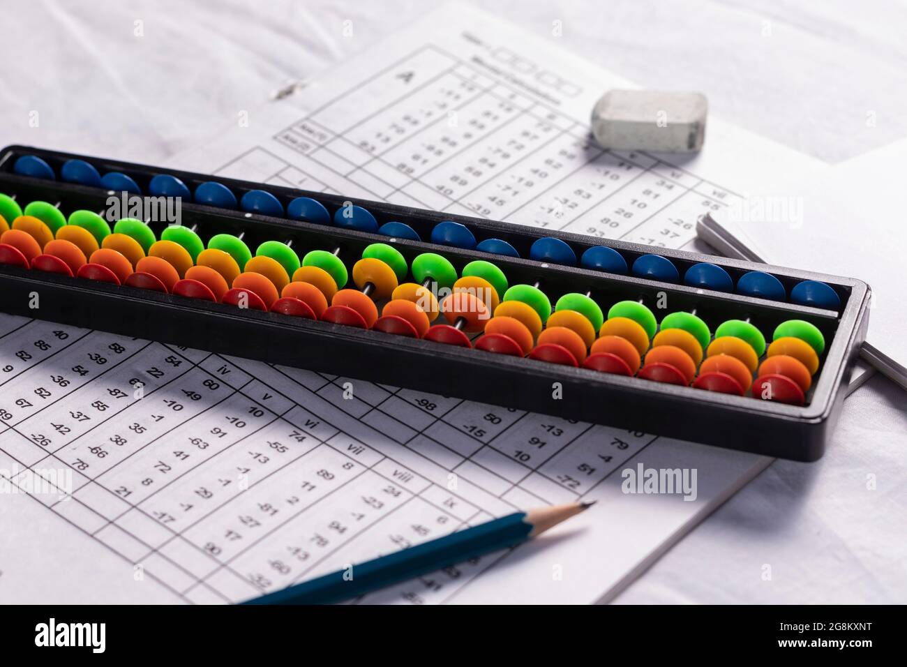 selective focus on colorful abacus on a mathematical problem sheet Stock  Photo - Alamy