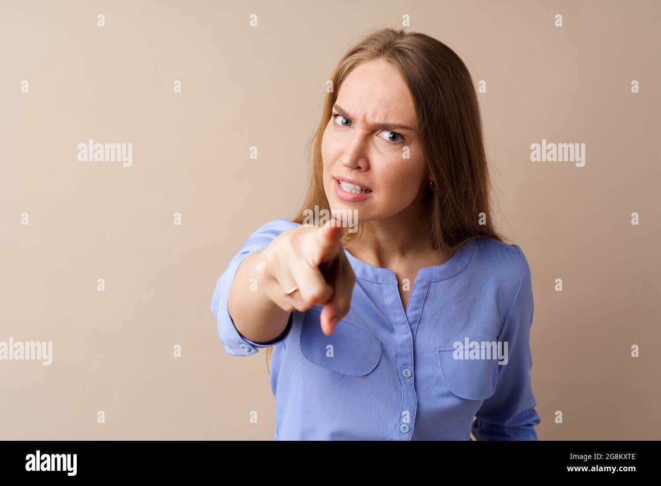 Outraged Photo Examples Portrait of angry outraged young woman pointing at camera Stock Photo ...