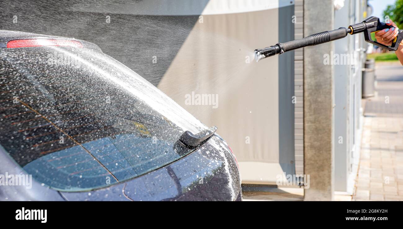 Car wash. The process of washing a car with active foam under pressure