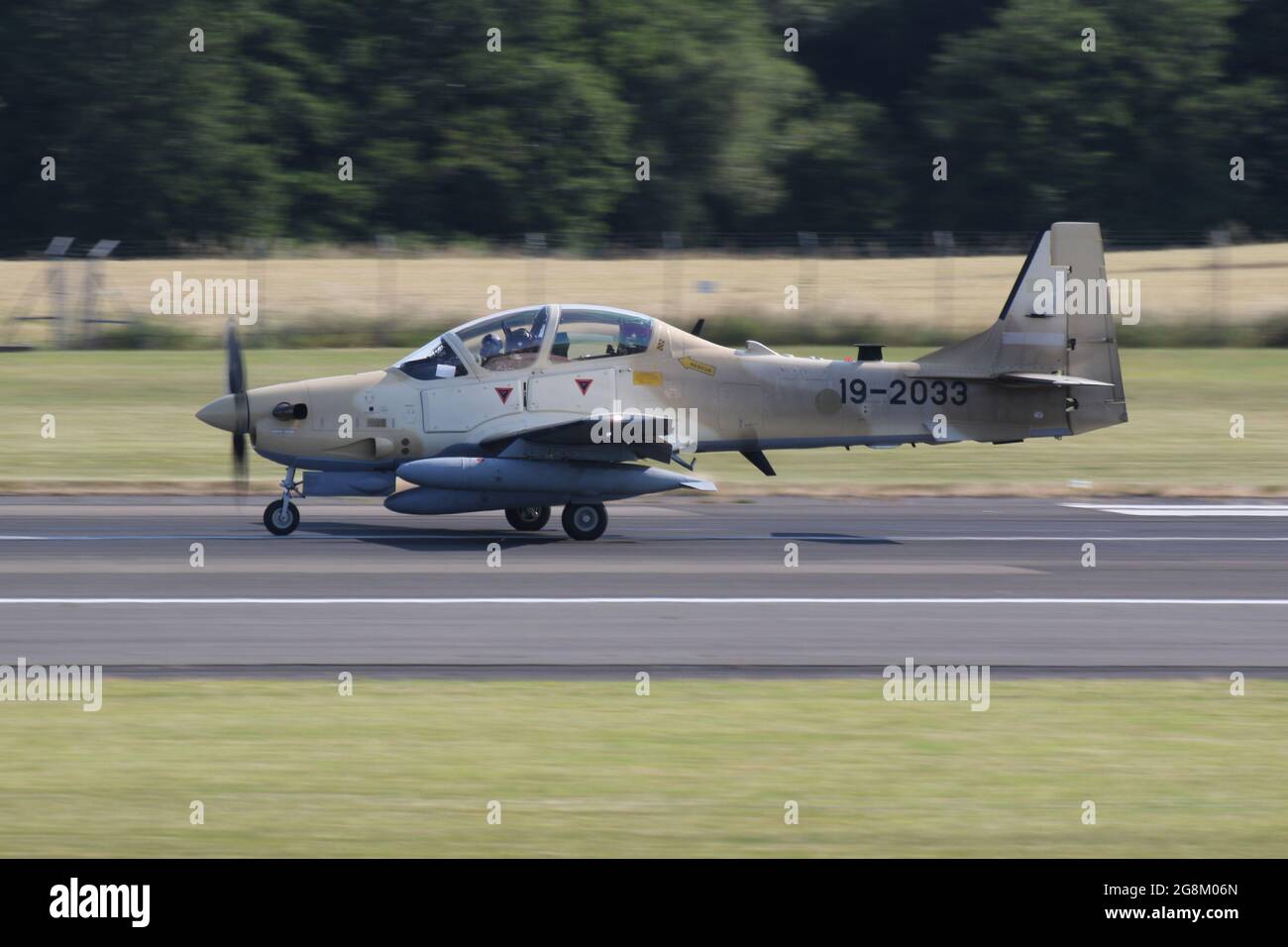 One of six Embraer A-29B Super Tucanos destined for the Nigerian Air Force (NAF), on departure from Prestwick International Airport on 20 July 2021. The aircraft was on a delivery flight from the USA to Nigeria, and wore a temporary US military serial (19-2033) for the flight. This particular airframe will become NAF845 in Nigerian Air Force service. Stock Photo