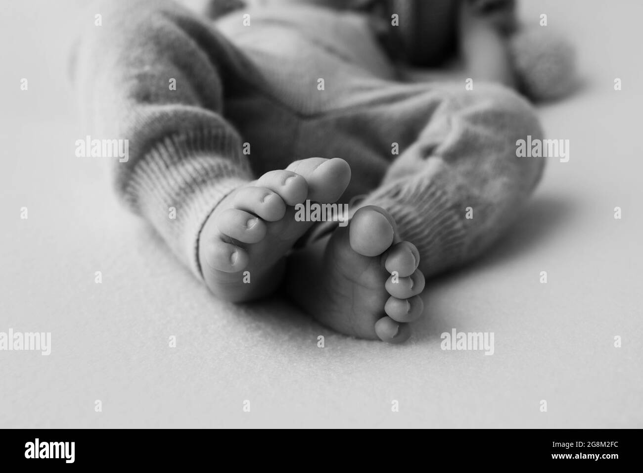 Newborn baby feet closeup. Pregnancy, motherhood, preparation and expectation of motherhood