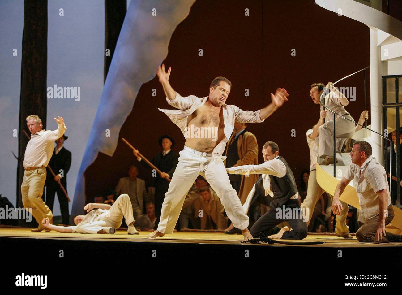 centre: Will Hartmann (Mark) in THE MIDSUMMER MARRIAGE by Michael Tippett at The Royal Opera, Covent Garden, London WC2  31/10/2005  conductor: Richard Hickox  design: Paul Brown  lighting: Wolfgang Gobbel  choreography: Ron Howell  director: Graham Vick Stock Photo