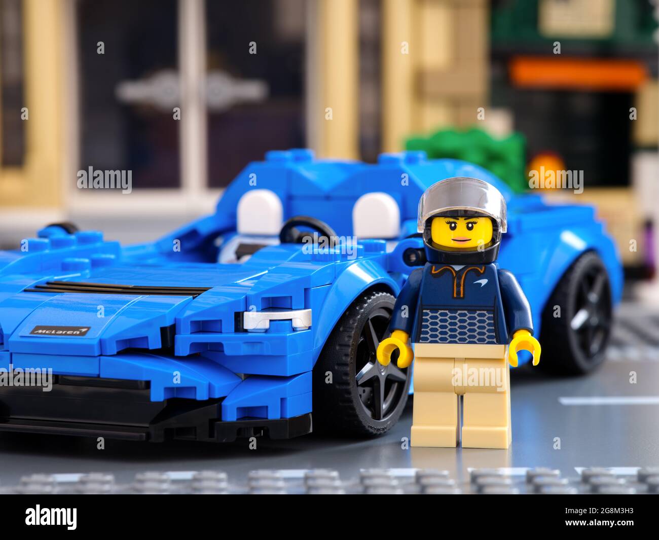 Tambov, Russian Federation - July 02, 2021 Lego driver minifigure near her car McLaren Elva by LEGO Speed Champions. Stock Photo