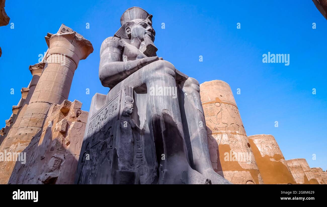 Huge statue of Ramesses II in Luxor Temple, Egypt Stock Photo - Alamy