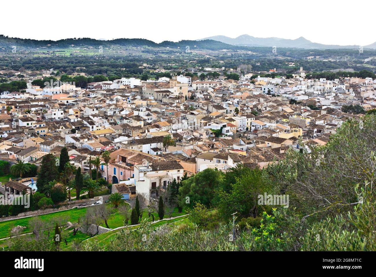 Arta, Majorca or Mallorca, Spain - January 29, 2015: Panoramic view over the roofs of the old town in soft evening light. Stock Photo
