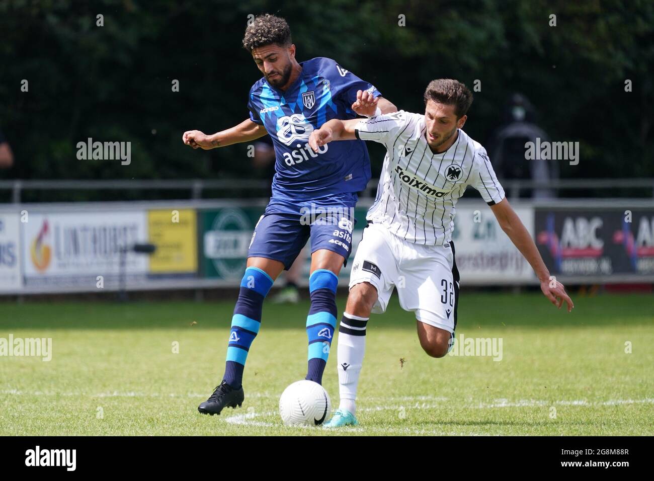 Apeldoorn, Netherlands. 21st July, 2021. APELDOORN, NETHERLANDS - JULY 21:  Bilal Basacikoglu of Heracles Almelo, Nika Ninua of PAOK FC during the  Pre-season Friendly match between Heracles Almelo and PAOK Saloniki on