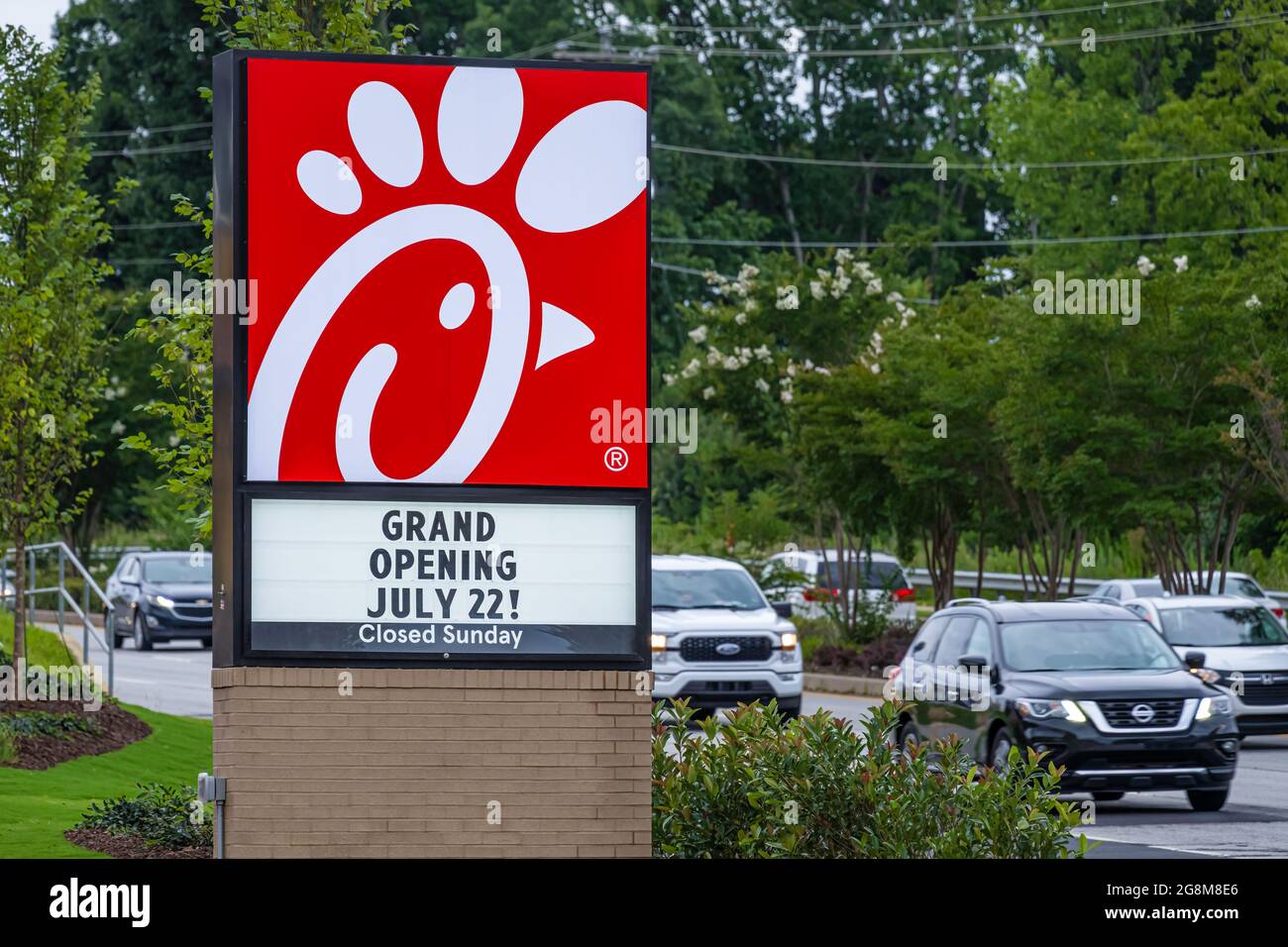 New Chick-fil-A restaurant location announcing its grand opening along busy Atlanta Highway (Hwy. 78/Main Street West) in Snellville, Georgia. (USA) Stock Photo