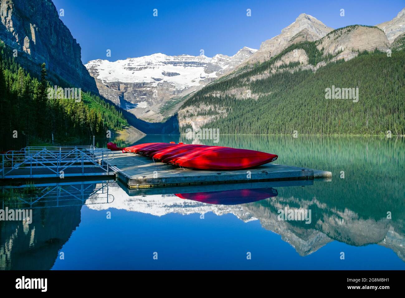 Banff Dock Red canoes on dock, Lake Louise, Banff National Park, Alberta Stock ...