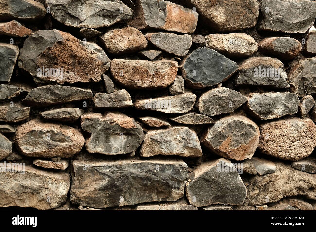 Stone wall, Texture of a stone wall. Stone wall texture background, rock  wall Stock Photo - Alamy