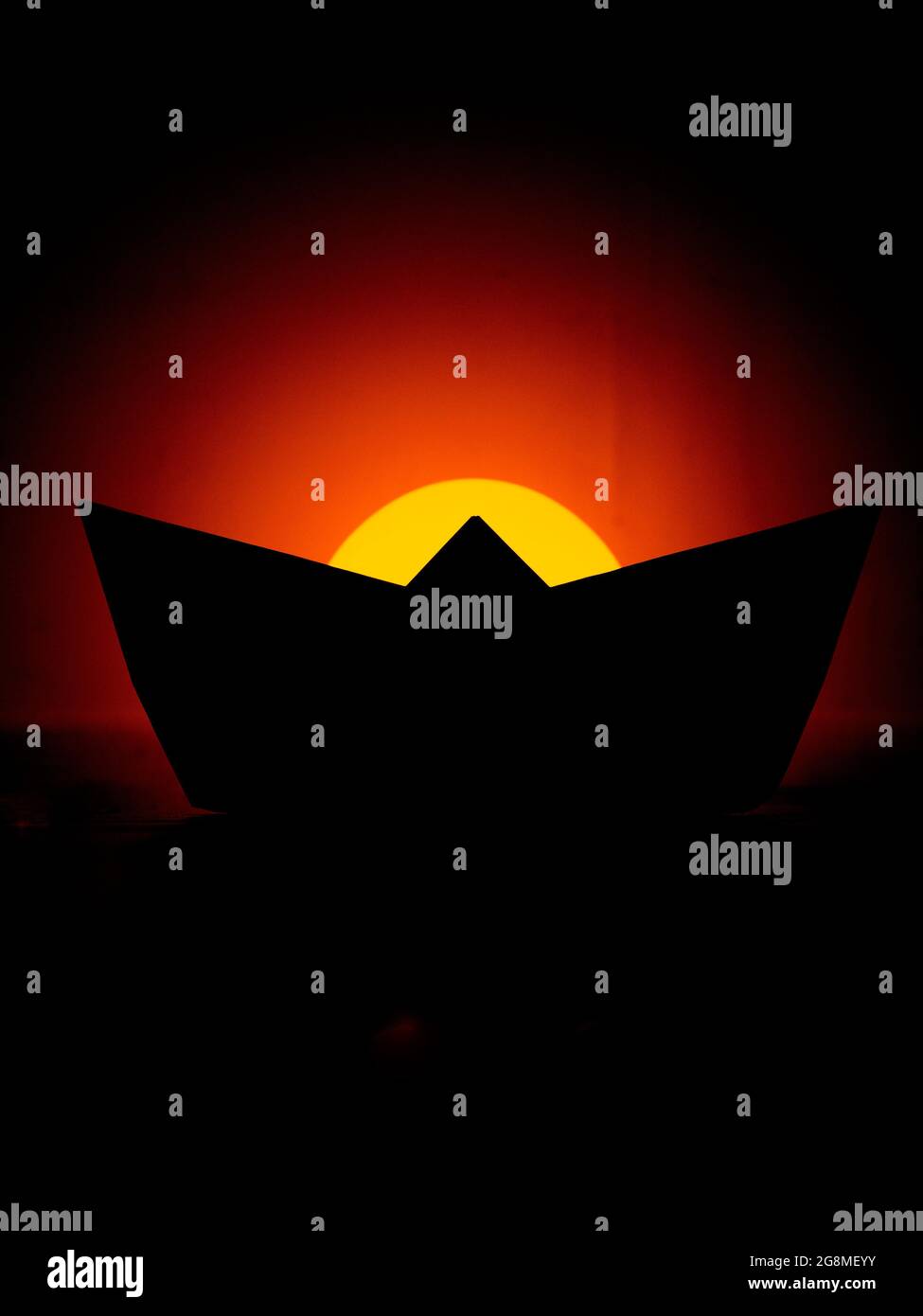 Book cover concept - Childhood - Silhouette of a paper boat Stock Photo
